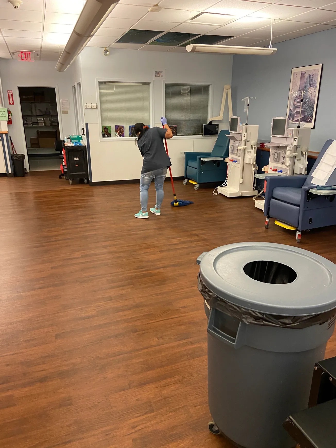 Team member mopping a dialysis treatment floor